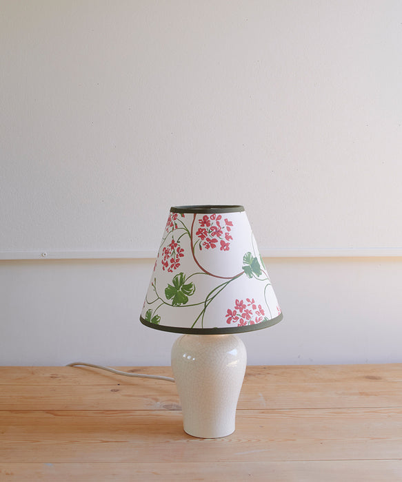 Geraniums, paper lampshade, empire