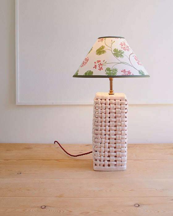 Geraniums, paper lampshade, conical